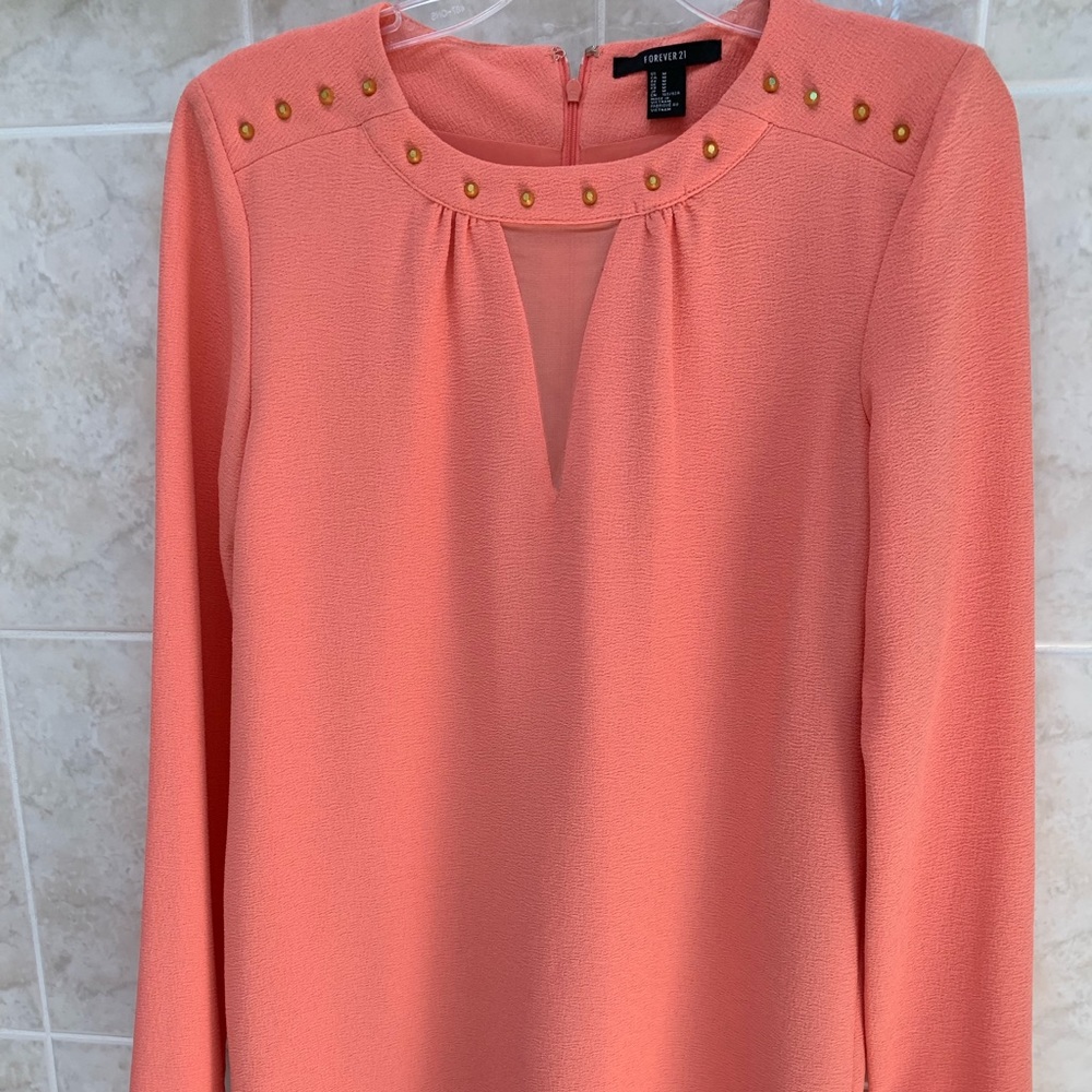 Salmon shift dresses with gold metal accents